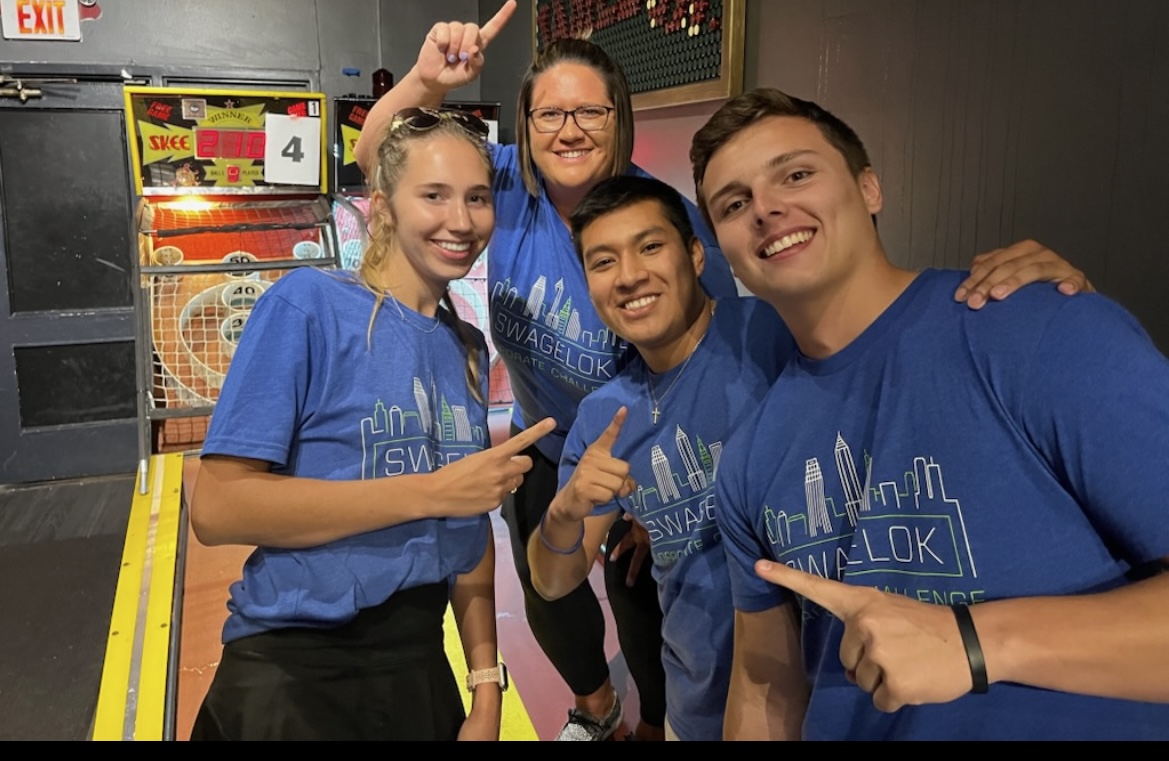 Tyler with group in Swagelok shirts